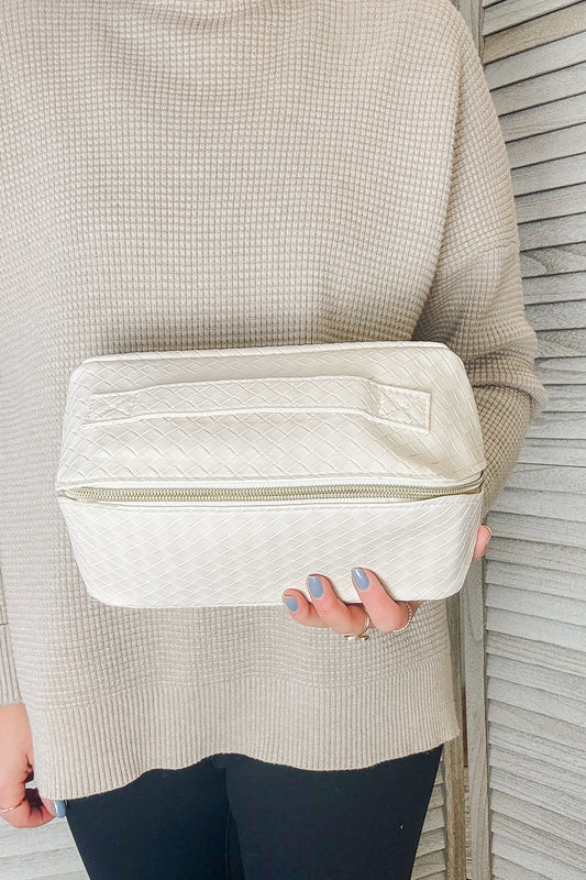 Zip pouch in woven ivory faux leather.