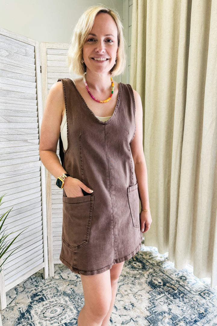 Women's denim dress with adjustable straps and front pockets brown