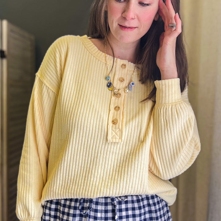 Long sleeve ribbed henley with exposed seam details