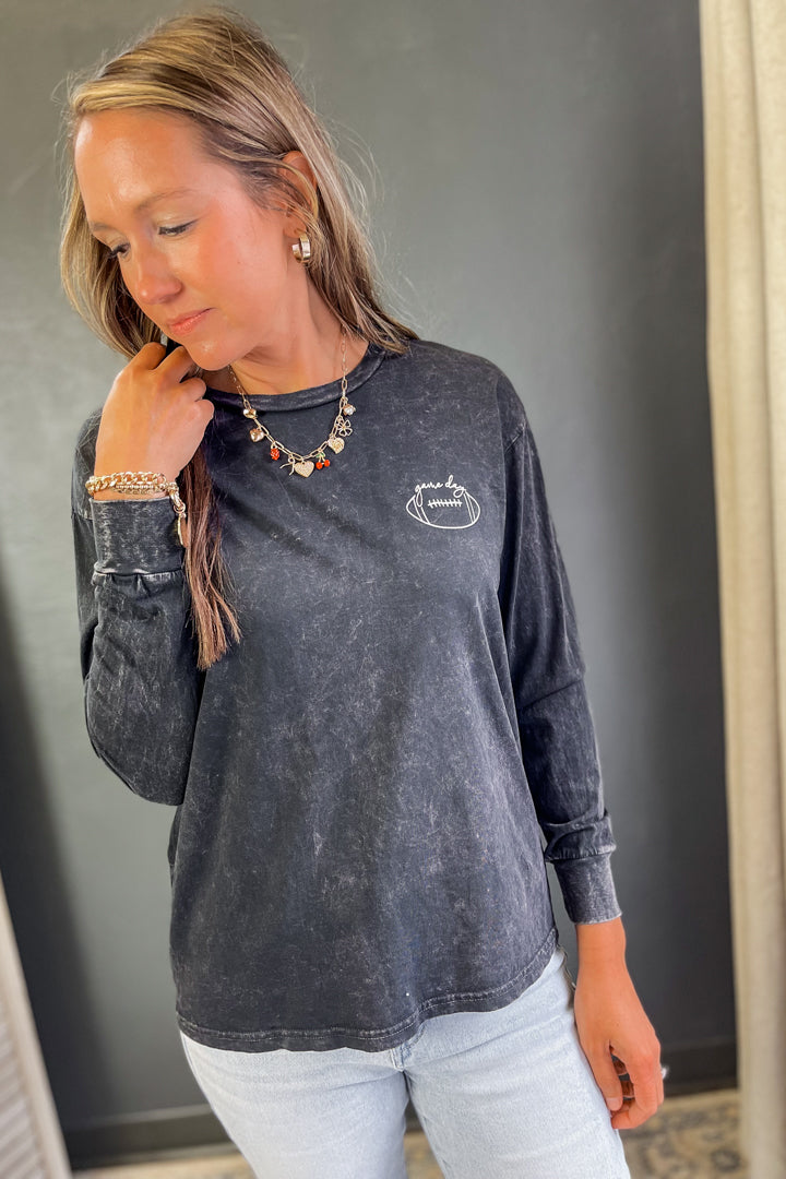 Women's long sleeve mineral washed graphic tee black game day football