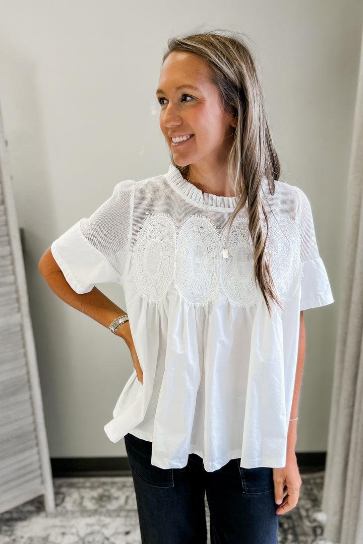 A flowy and feminine white top for women