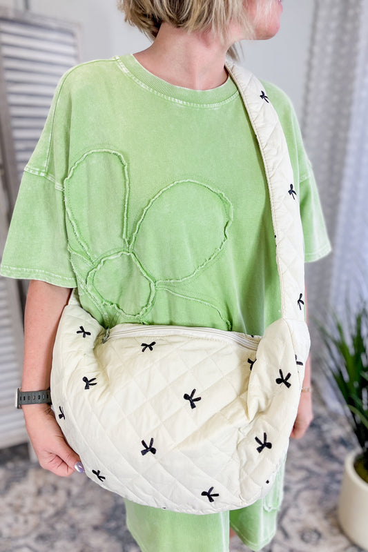 Quilted shoulder bag with fun bow embroidery