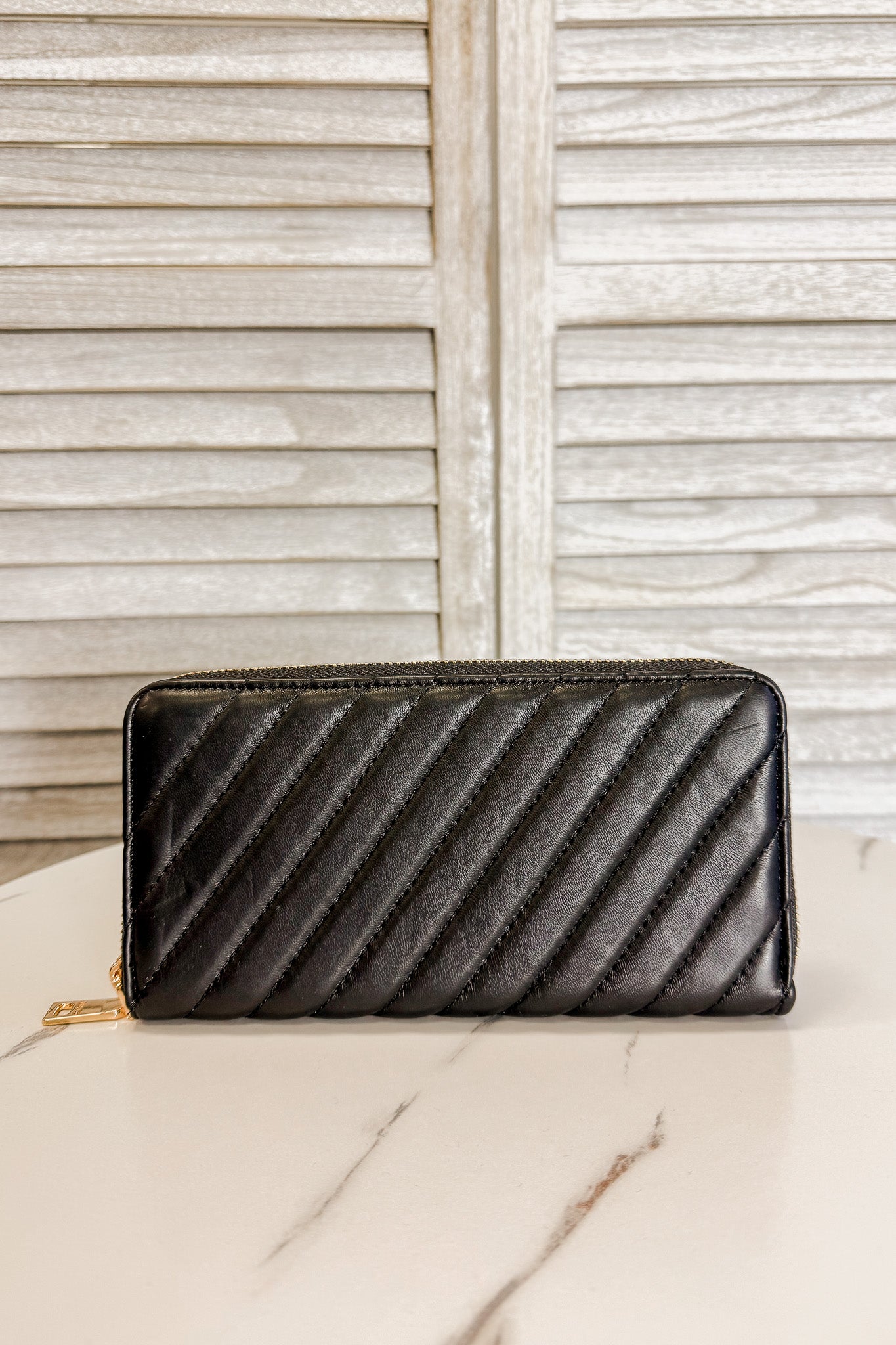 quilted, multi-compartment wallet black
