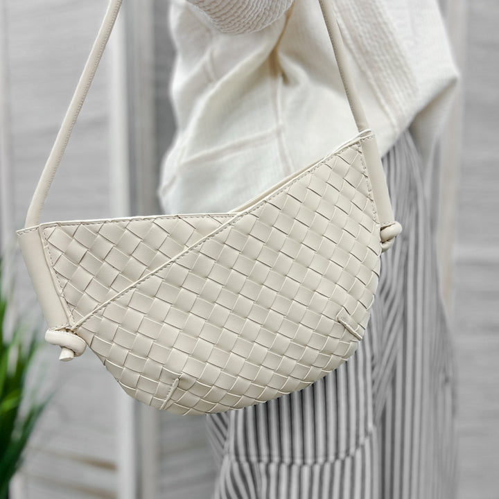 A small shoulder bag with knotted strap detail ivory