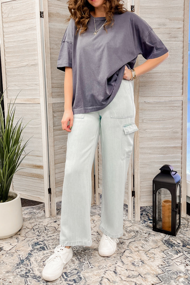 Wide leg cargo pants with elastic waist and drawstring.