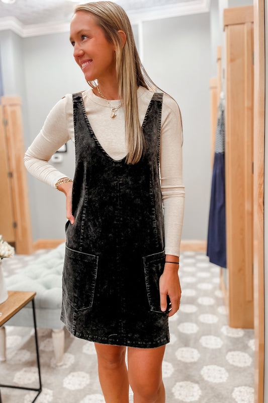 Black corduroy pinafore overall dress with pockets for women.