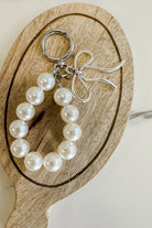 Pearl and silver bow charm keychain