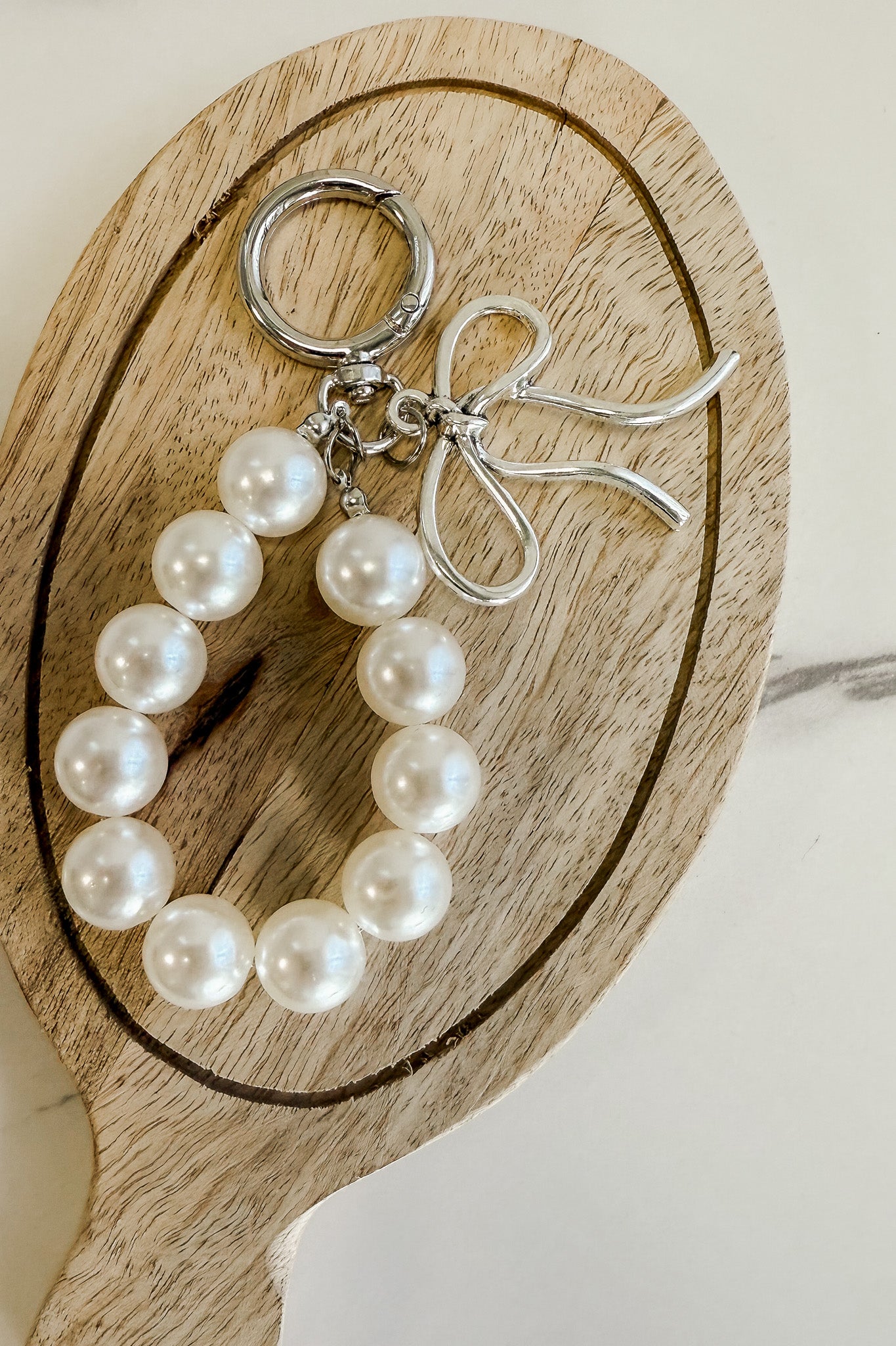 Pearl and silver bow charm keychain