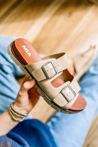 Buckle strap sandals with slight platform sole.