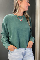 A waffle knit long sleeve top dark green