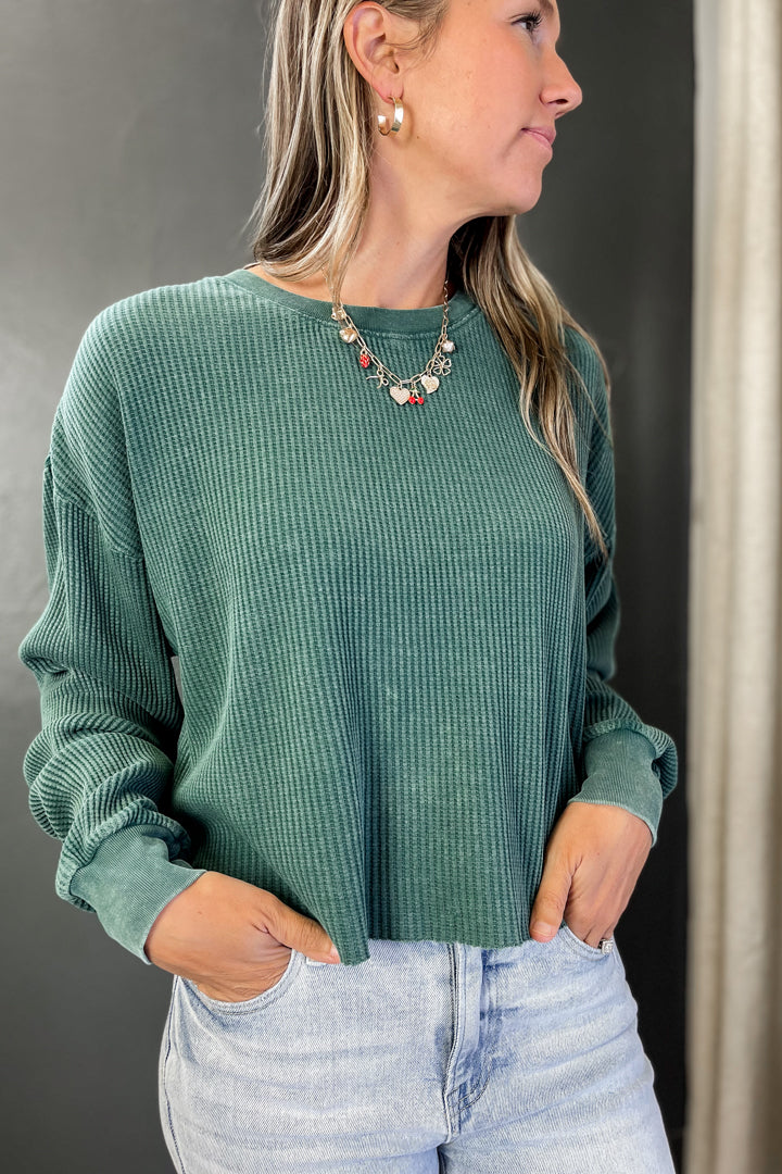 A waffle knit long sleeve top dark green