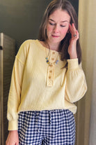 Long sleeve ribbed henley with exposed seam details