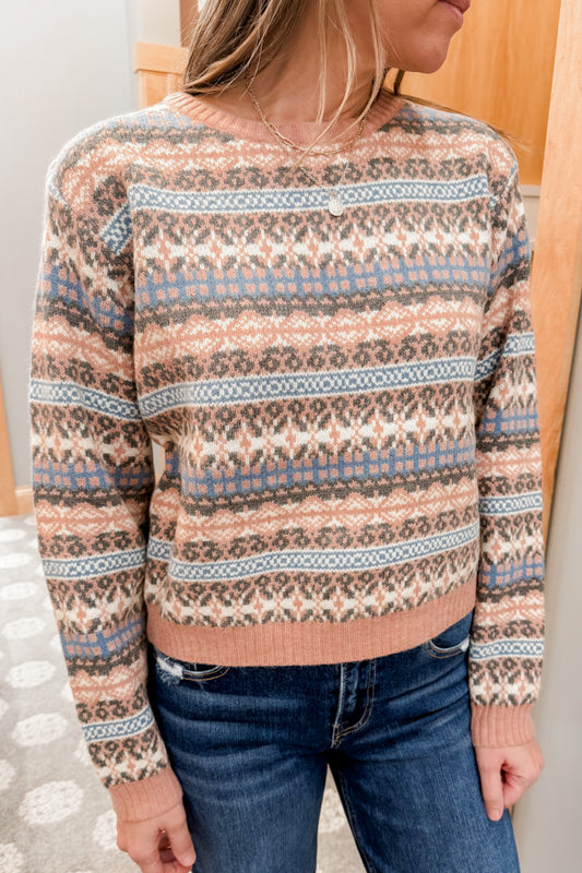 Women's cropped fair isle patterned knit sweater.