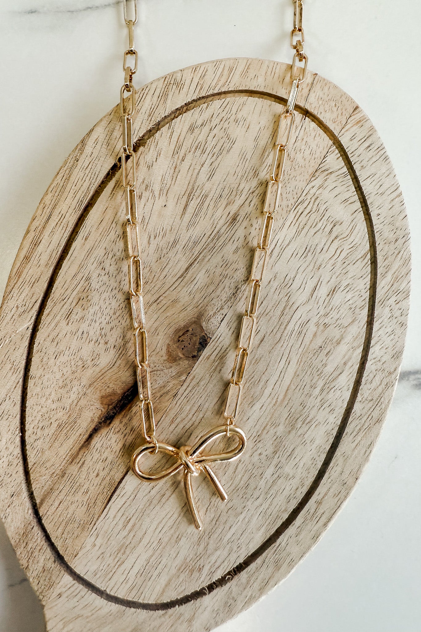 gold paperclip chain bow charm necklace