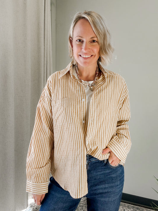 A stripe mustard button down top for women.