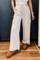 Wide leg cargo pants with pockets and flattering smocked waist.
