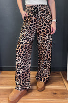 Leopard print pants with flattering black stripe.