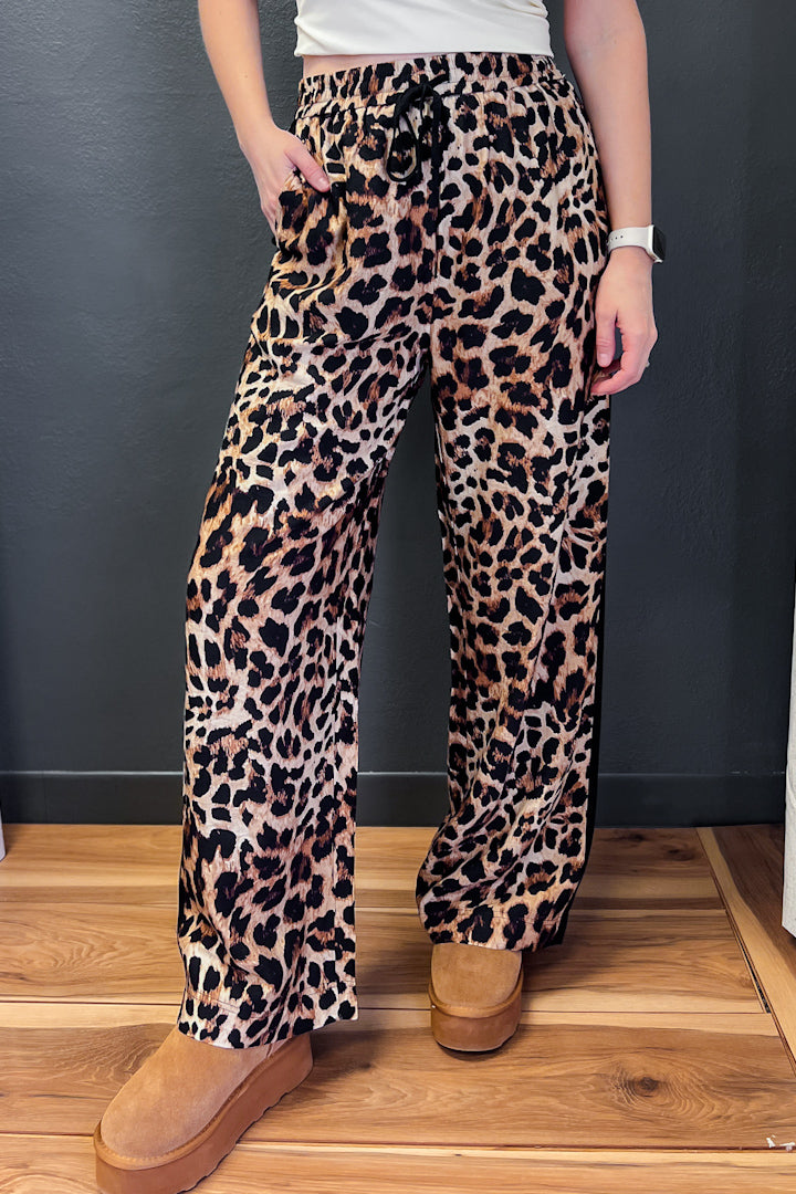 Leopard print pants with flattering black stripe.