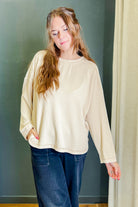Ribbed crewneck top with raw seam details beige