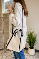 Women's straw crossbody bag with vegan leather straps