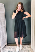 Midi-length polka dot dress with cap sleeves black