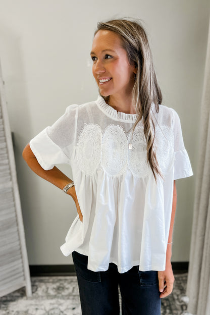 A flowy and feminine white top for women
