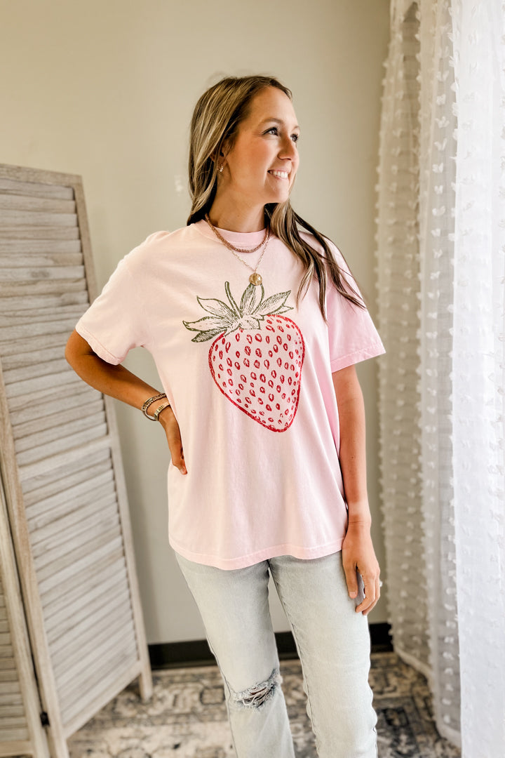 Women's oversized tee with strawberry graphic pink