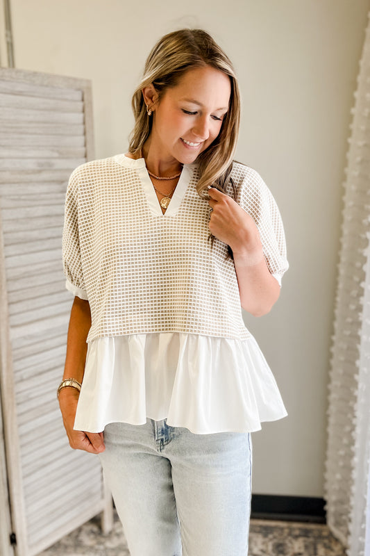 Women's textured knit blouse with peplum detail cream