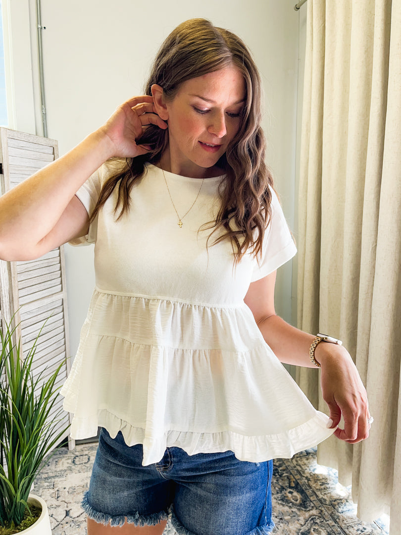 Women's oversized peplum top with rolled sleeves