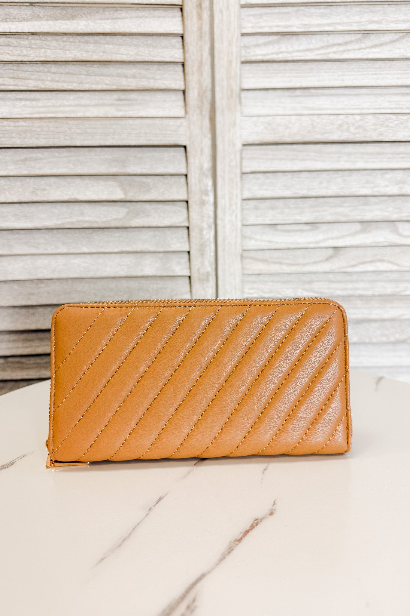 quilted, multi-compartment wallet camel brown