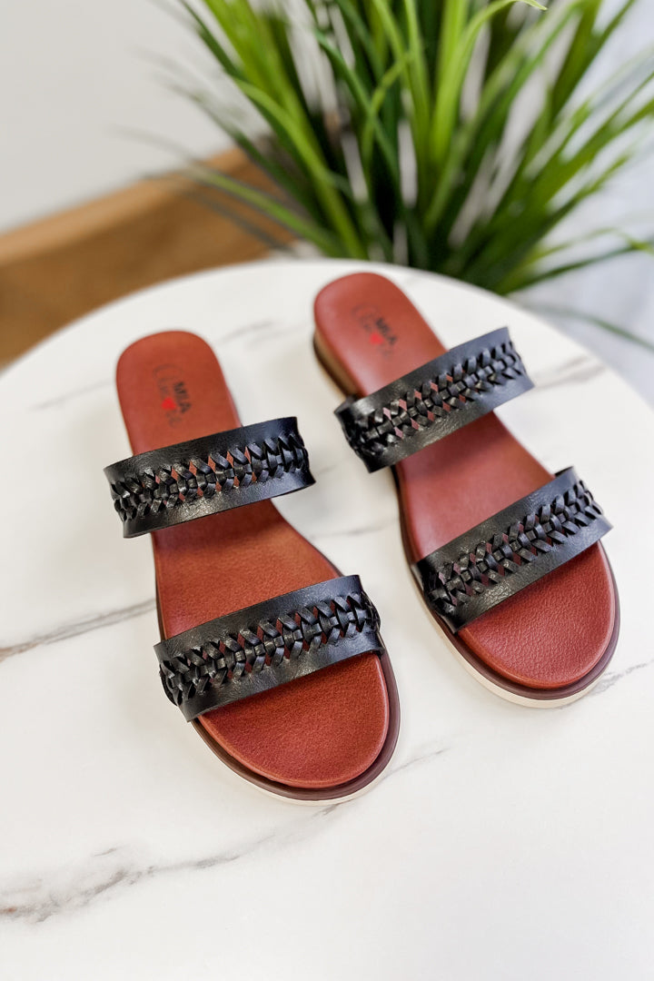 Women's faux leather wedge sandals with braided strap details