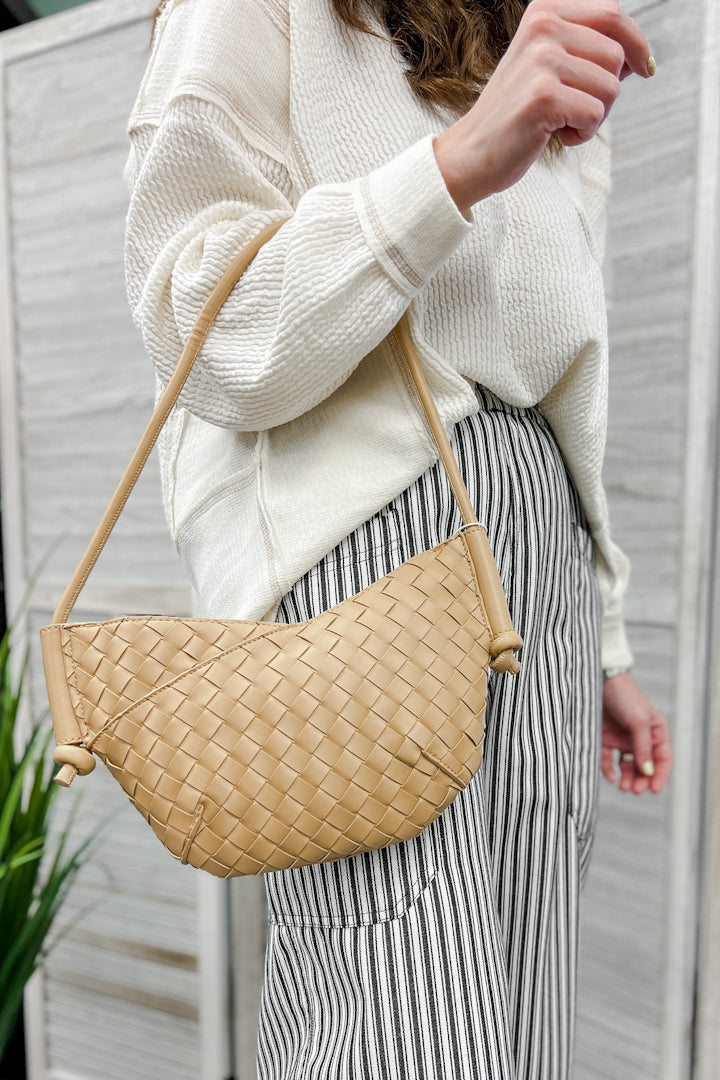 A small shoulder bag with knotted strap detail beige