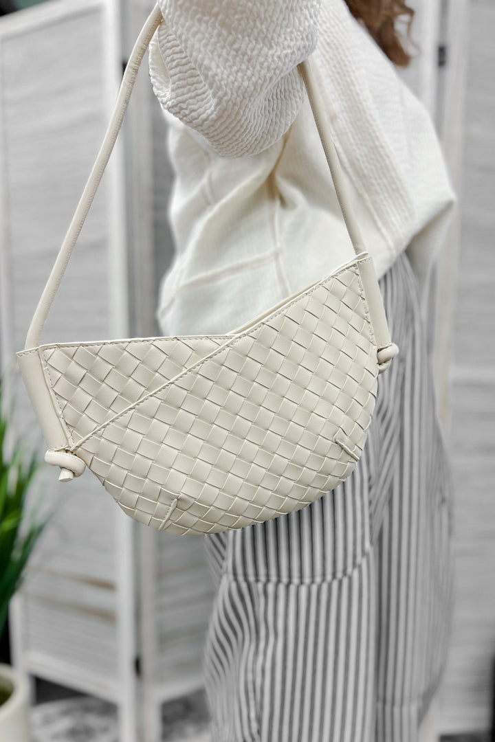 A small shoulder bag with knotted strap detail ivory