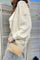 A woven slim envelope with a playful metal sea-inspired charm chain beige