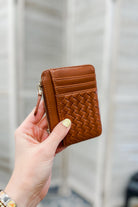 A small slim woven wallet brown