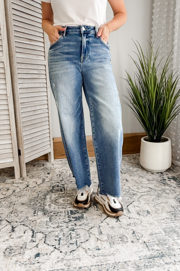 Women's high rise denim with wide cropped leg and slight distressing