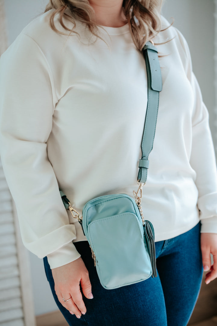 light blue sport cross body purse with card pouch vegan leather strap