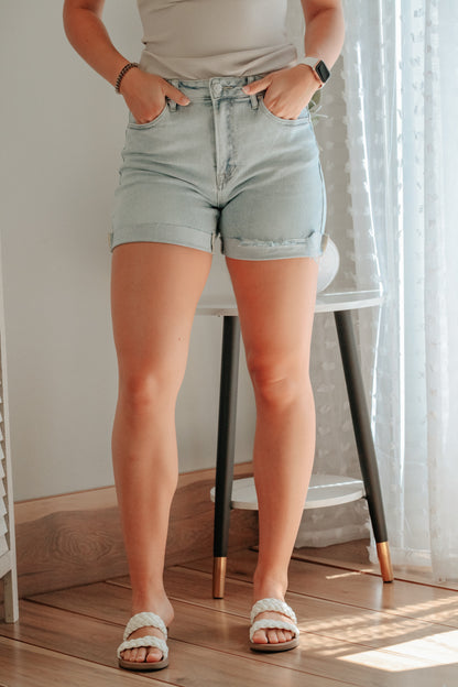 womens high rise light wash denim shorts with folded pocket detail